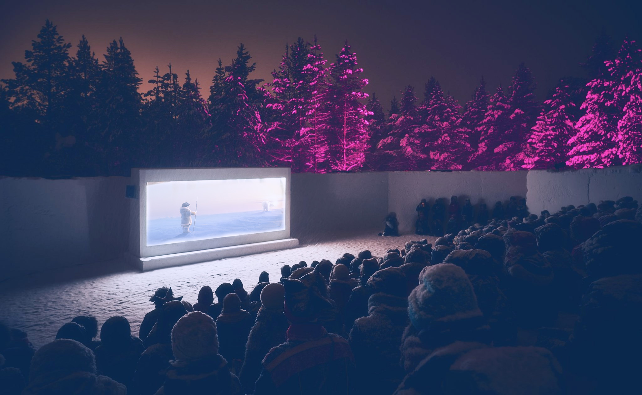 Yleisö katsoo Lumiteatterissa lumesta valmistetulta valkokankaalta elokuvaa.
